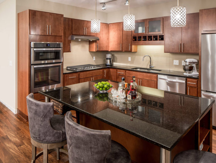 Large open kitchen with brown cabinets and a center island